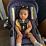 Amelia joined the competition — help win amazing prizes! baby, car_seat, child, indoor, yellow_outfit, white_socks, hair_clips, curious_expression, purple_car_seat, seat_belt, face, small_hands, small_feet, furniture, cushion, floor, wood_floor, home, sitting, child_safety