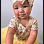 toddler, child, baby, yellow_tutu, headband, smile, cute, arms, wall, indoor, portrait, clothing, face, happy, person, fashion, infant, playful, yellow, closeup