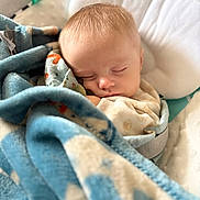 Cyrus joined the competition — help win amazing prizes! baby, sleeping, blanket, blue, cushion, infant, soft, cozy, closeup, face, peaceful, rest, cute, child, indoors, comfort, nap, wrapped, portrait, young