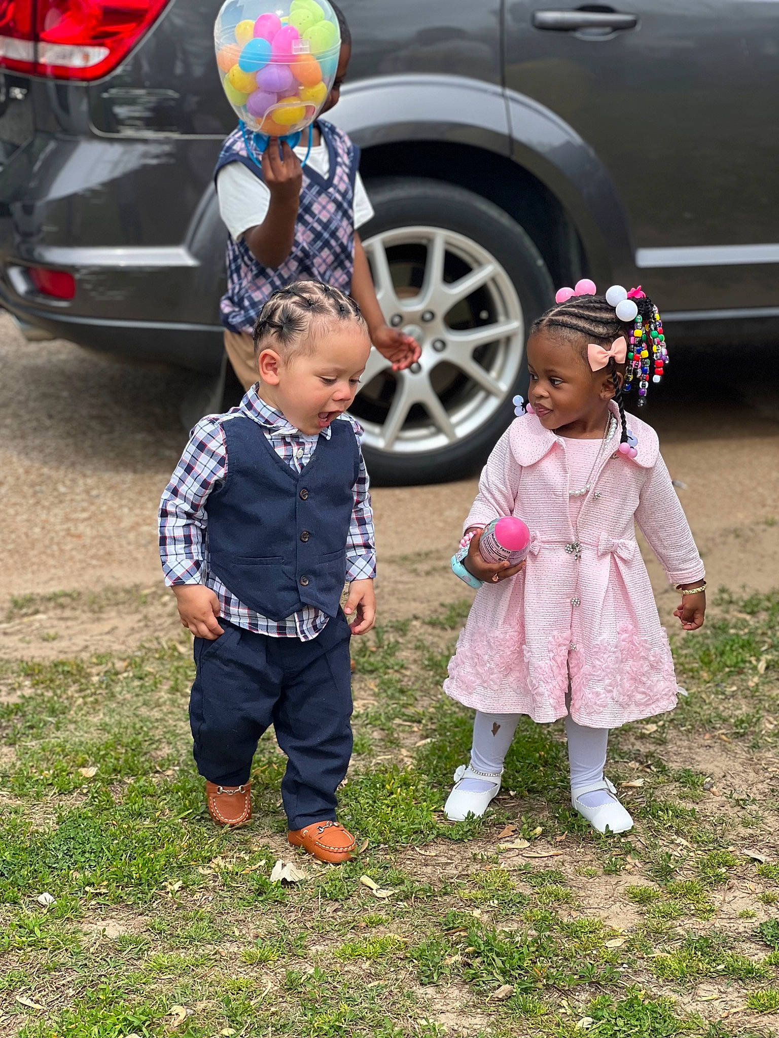 Gianna is registered to the contest to win money with this photo: auto_part, automotive_design, automotive_exterior, automotive_lighting, automotive_tire, automotive_wheel_system, car, child, grass, hat, land_vehicle, mammal, motor_vehicle, people, person, tire, toddler, vehicle, vehicle_door, vertebrate