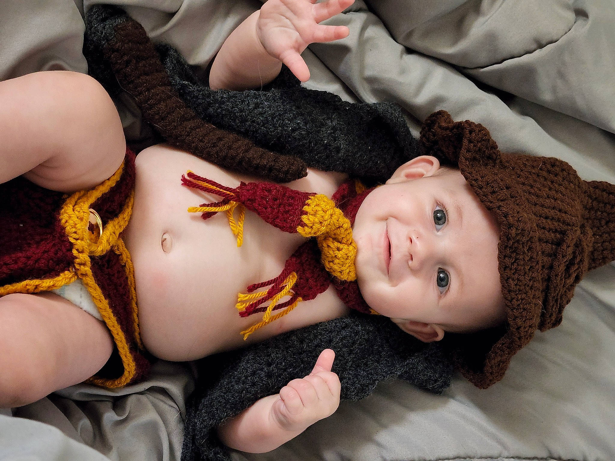 Theo is registered to the contest to win money with this photo: cheek, chest, comfort, eye, eyelash, finger, gesture, happy, head, headwear, human_body, joint, joy, lip, mammal, mouth, person, skin, smile, textile