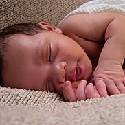 Ryker is registered to the contest to win money with this photo: baby, sleeping, infant, blanket, soft, cozy, peaceful, closeup, skin, hand, face, newborn, rest, comfort, cute, child, portrait, relax, warm, texture
