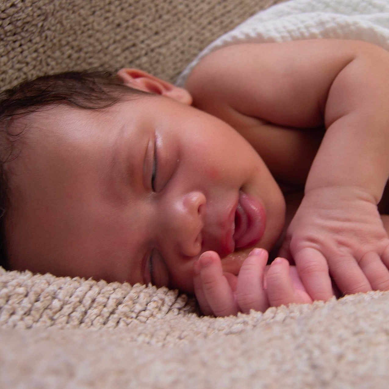 Ryker is registered to the contest to win money with this photo: baby, sleeping, infant, blanket, soft, cozy, peaceful, closeup, skin, hand, face, newborn, rest, comfort, cute, child, portrait, relax, warm, texture