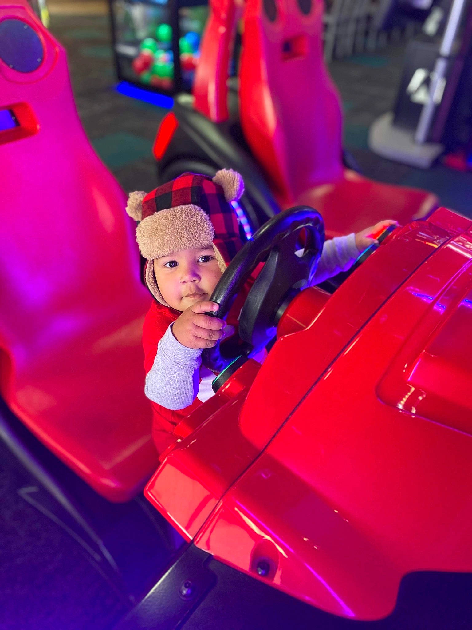 Cairo is registered to the contest to win money with this photo: automotive_design, automotive_exterior, automotive_lighting, bumper, car, electric_blue, entertainment, fictional_character, headlamp, headwear, hood, magenta, motor_vehicle, person, personal_luxury_car, pink, purple, red, toy, vehicle