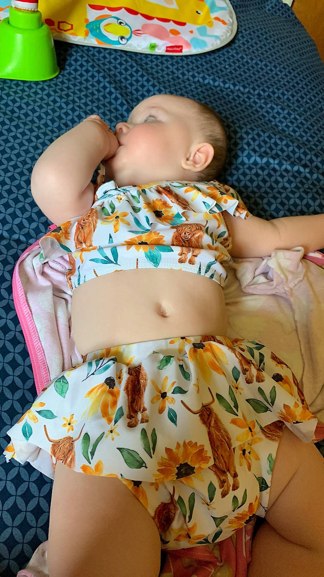 Ava is registered to the contest to win money with this photo: abdomen, baby, baby_toddler_clothing, beauty, chest, green, human_body, leg, navel, orange, pattern, person, pink, plant, skin, stomach, thigh, toddler, trunk, waist