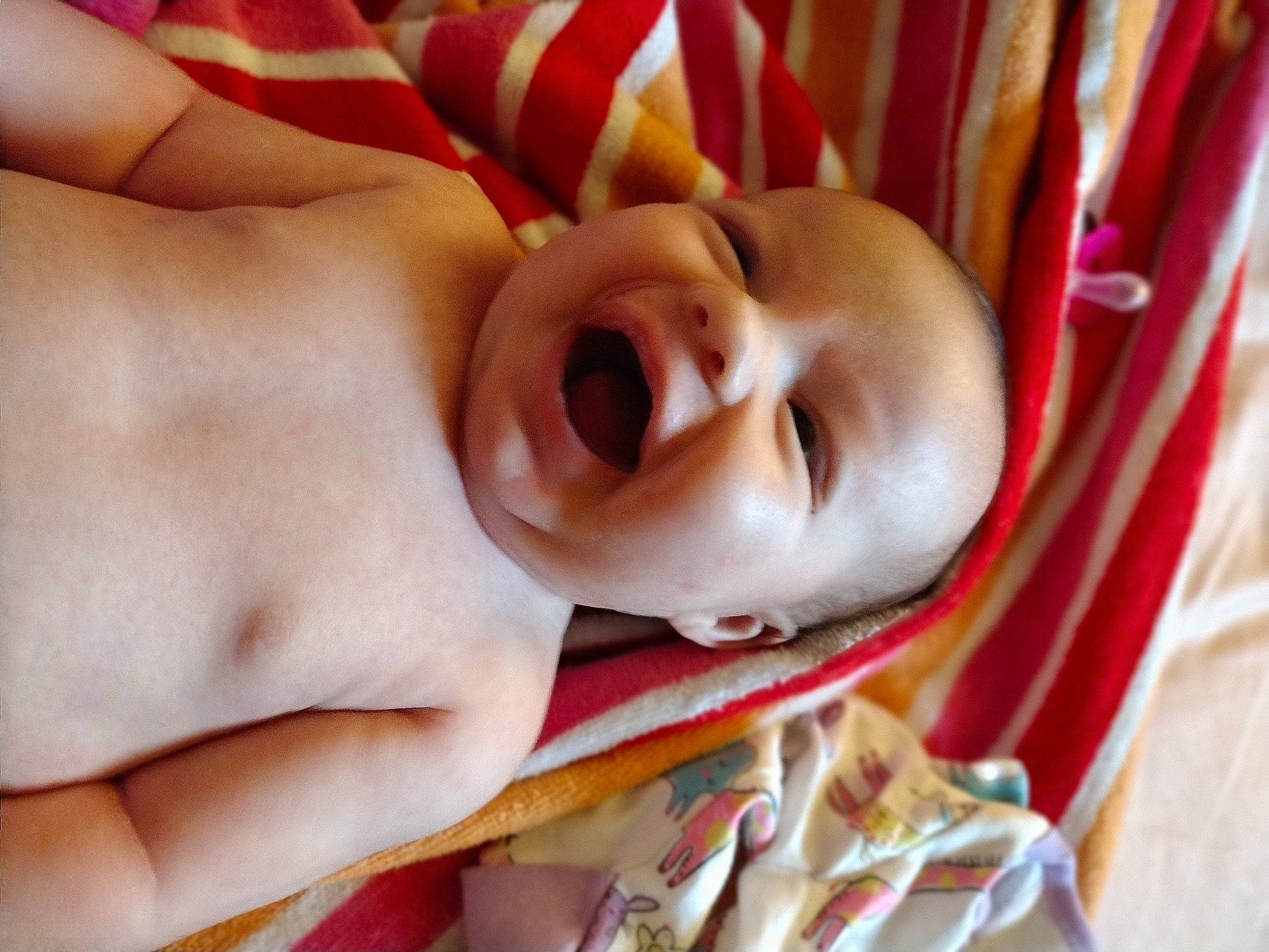 Hayley is registered to the contest to win money with this photo: baby, cheek, chin, comfort, eye, eyebrow, eyelash, face, facial_expression, finger, happy, headgear, human_body, linens, lip, mouth, nose, person, skin, smile