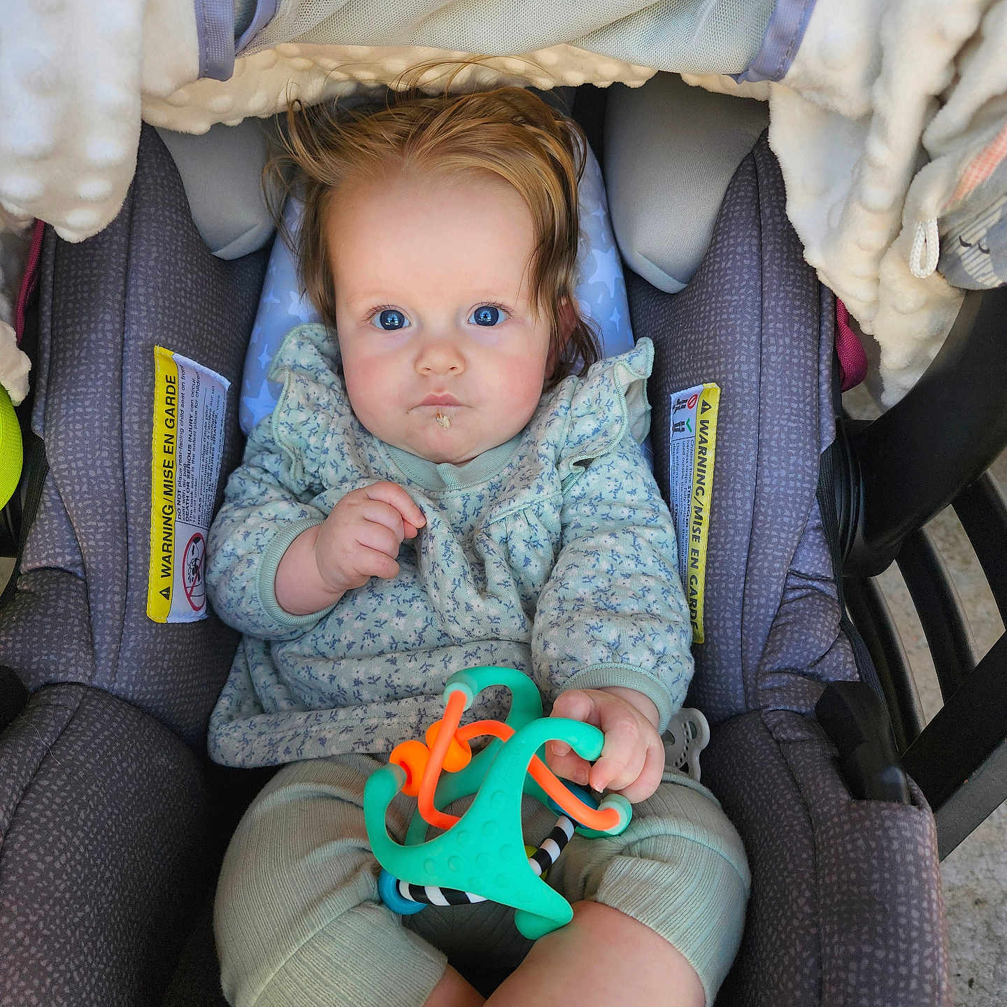 Whitley is registered to the contest to win money with this photo: baby, clothing, coat, couch, cushion, face, footwear, furniture, hat, head, homedecor, jacket, pants, person, photography, portrait, shoe, toy, transportation, vehicle