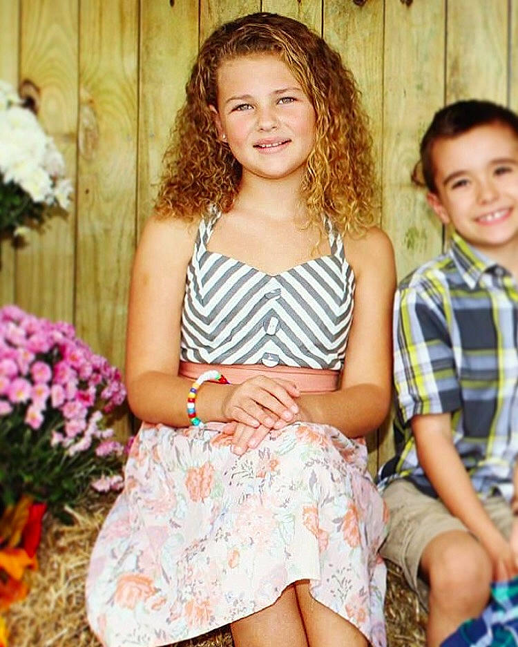 Avelina joined the competition — help win amazing prizes! abdomen, beauty, child, child_model, clothing, dress, fashion, happy, joy, leg, pattern, person, photo_shoot, photography, pink, plant, sitting, smile, spring, summer