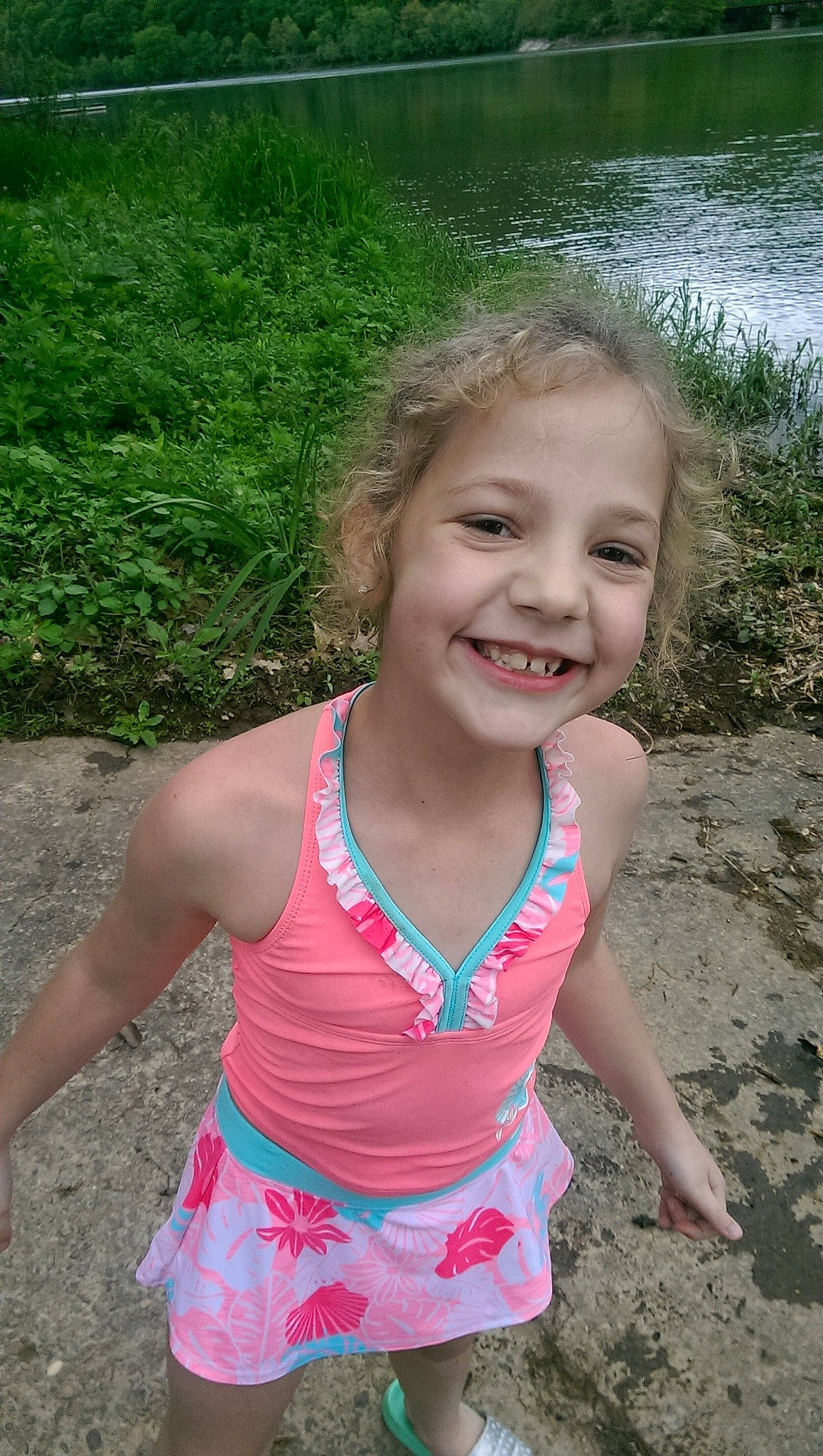 Livia is registered to the contest to win money with this photo: child, facial_expression, finger, fun, happy, joy, leisure, person, pink, play, smile, summer, toddler, tooth, vacation, water