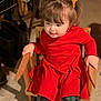 Kinzel is registered to the contest to win money with this photo: toddler, child, red_dress, pigtails, orange_bows, wooden_chair, indoor, smiling, happy, legs, footwear, patterned_leggings, short_hair, playful, young_child, person, casual_clothing, seated, light_shadow, portrait