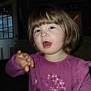 Kinzel joined the competition — help win amazing prizes! child, toddler, girl, indoor, purple_shirt, hearts, gesture, brown_hair, curly_hair, long_sleeve, person, face, expression, door, window, couch, home, portrait, casual, young