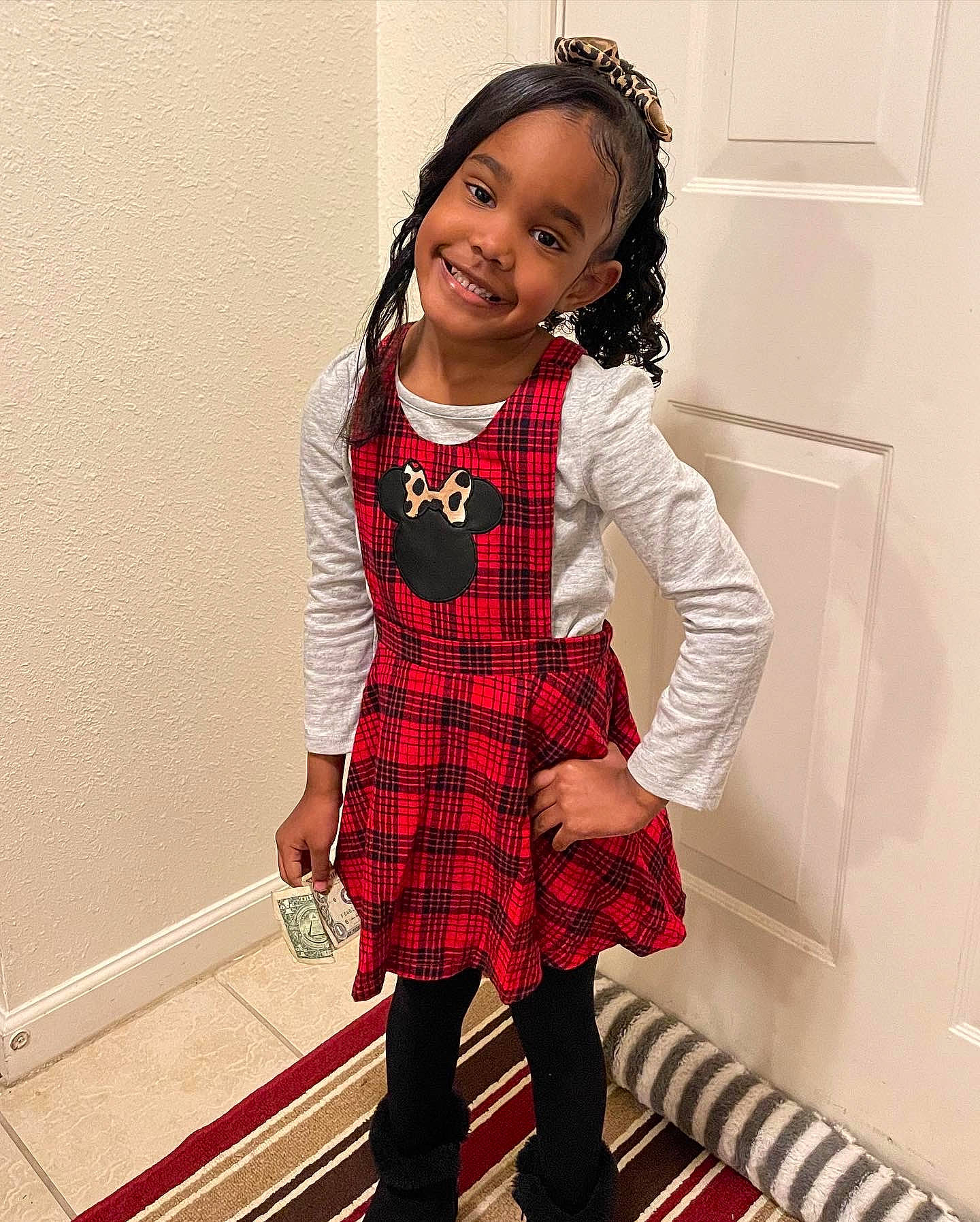 Iylan is registered to the contest to win money with this photo: baby_toddler_clothing, black_hair, collar, dress, face, fashion_design, hair, hairstyle, happy, human_body, joy, knee, leg, neck, outerwear, person, plaid, sleeve, tartan, thigh