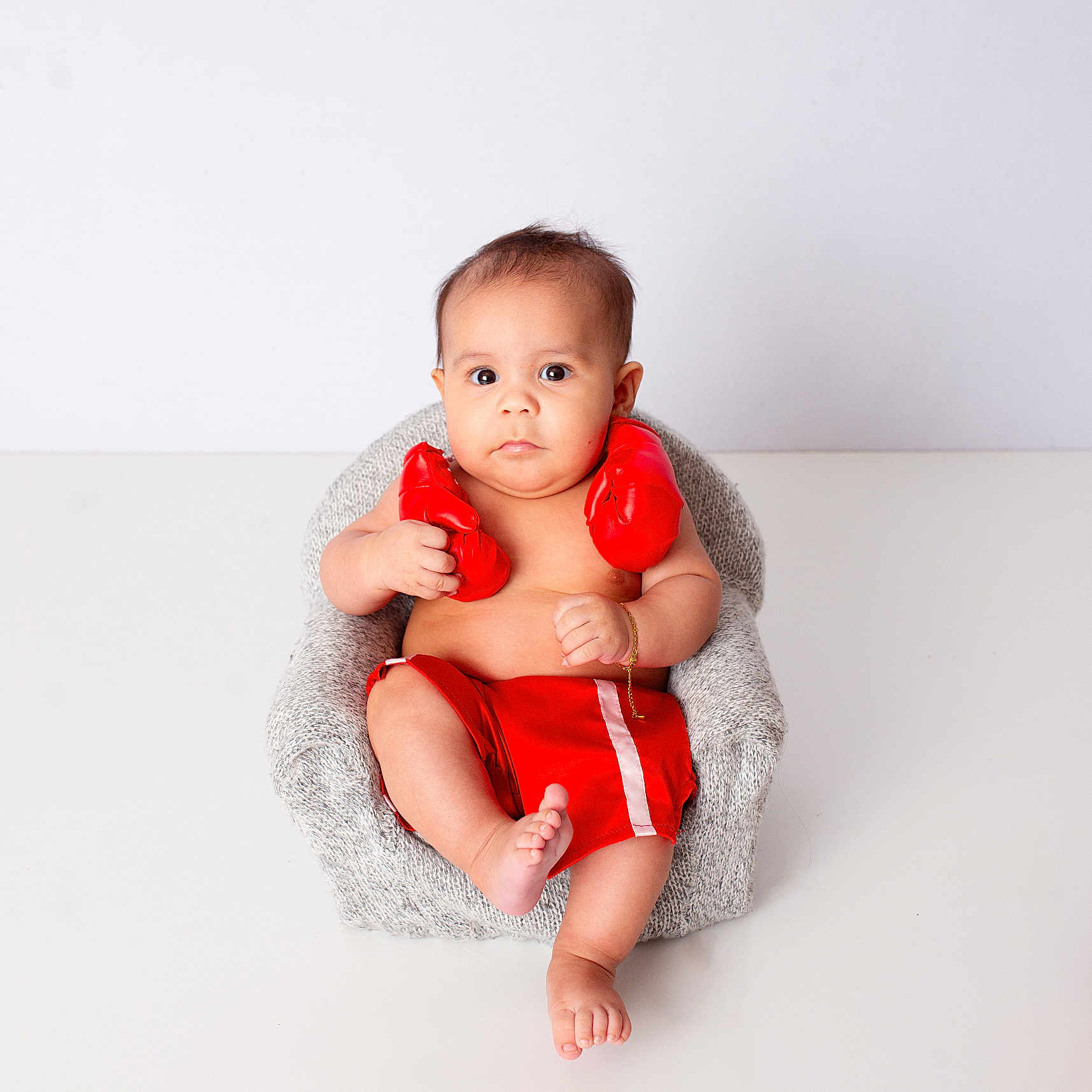 Inzo is registered to the contest to win money with this photo: armchair, baby, ball, barefoot, bathing, bathtub, blanket, bodypart, chair, clothing, cushion, diaper, dress, face, finger, fist, football, furniture, hand, happy