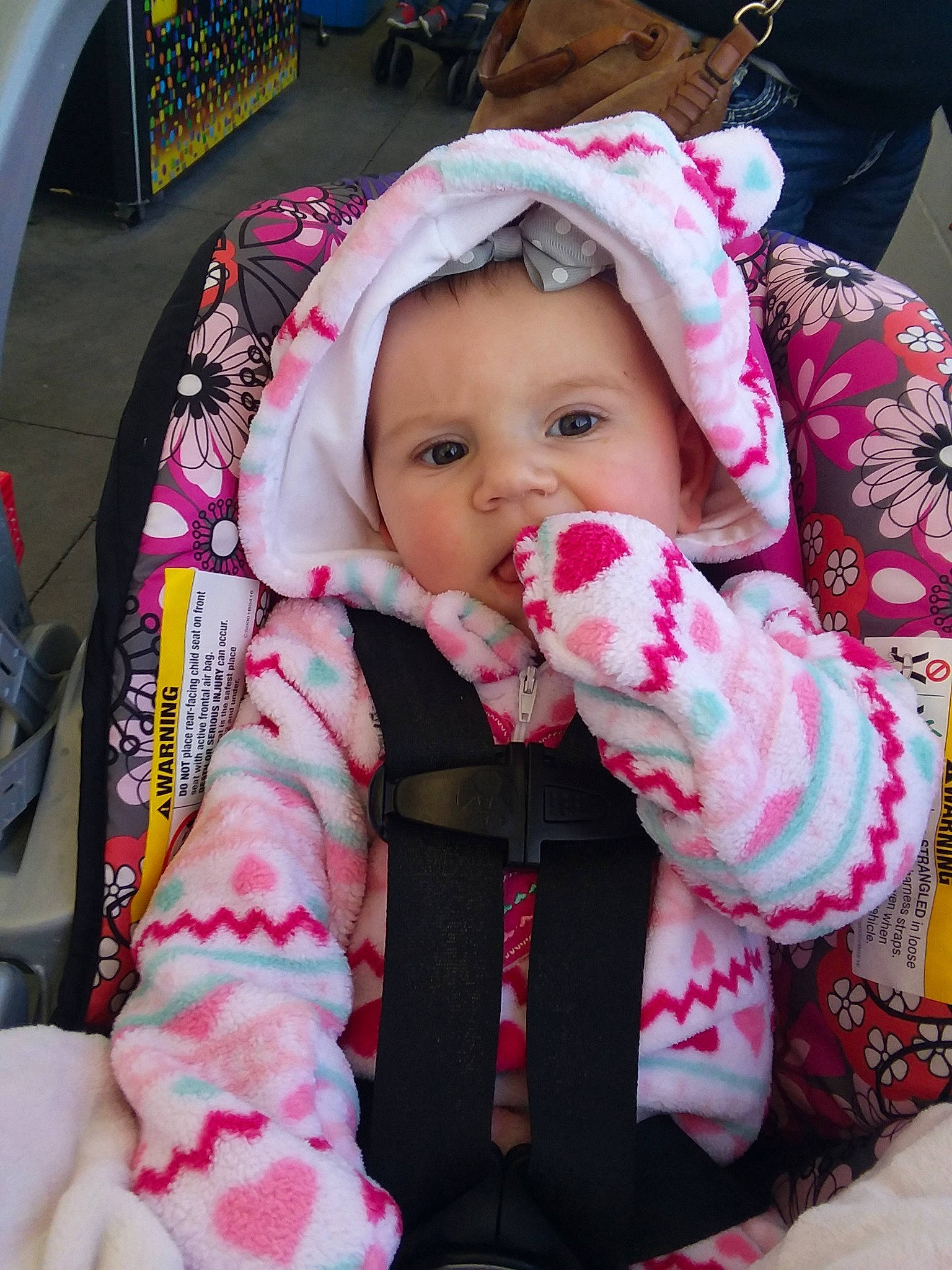 Caitlin is registered to the contest to win money with this photo: baby, baby_products, car_seat, cheek, child, head, person, pink, product, toddler