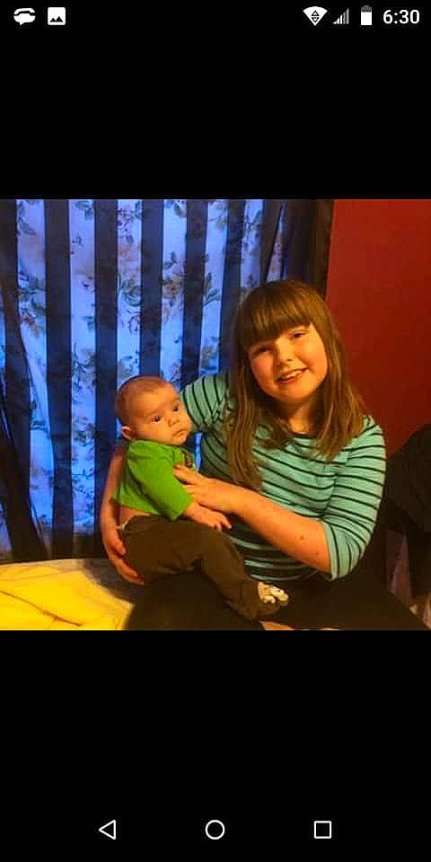 Cale is registered to the contest to win money with this photo: animation, baby, child, conversation, darkness, entertainment, event, flash_photography, fun, happy, joy, magenta, night, performance, performing_arts, person, play, room, sitting, smile