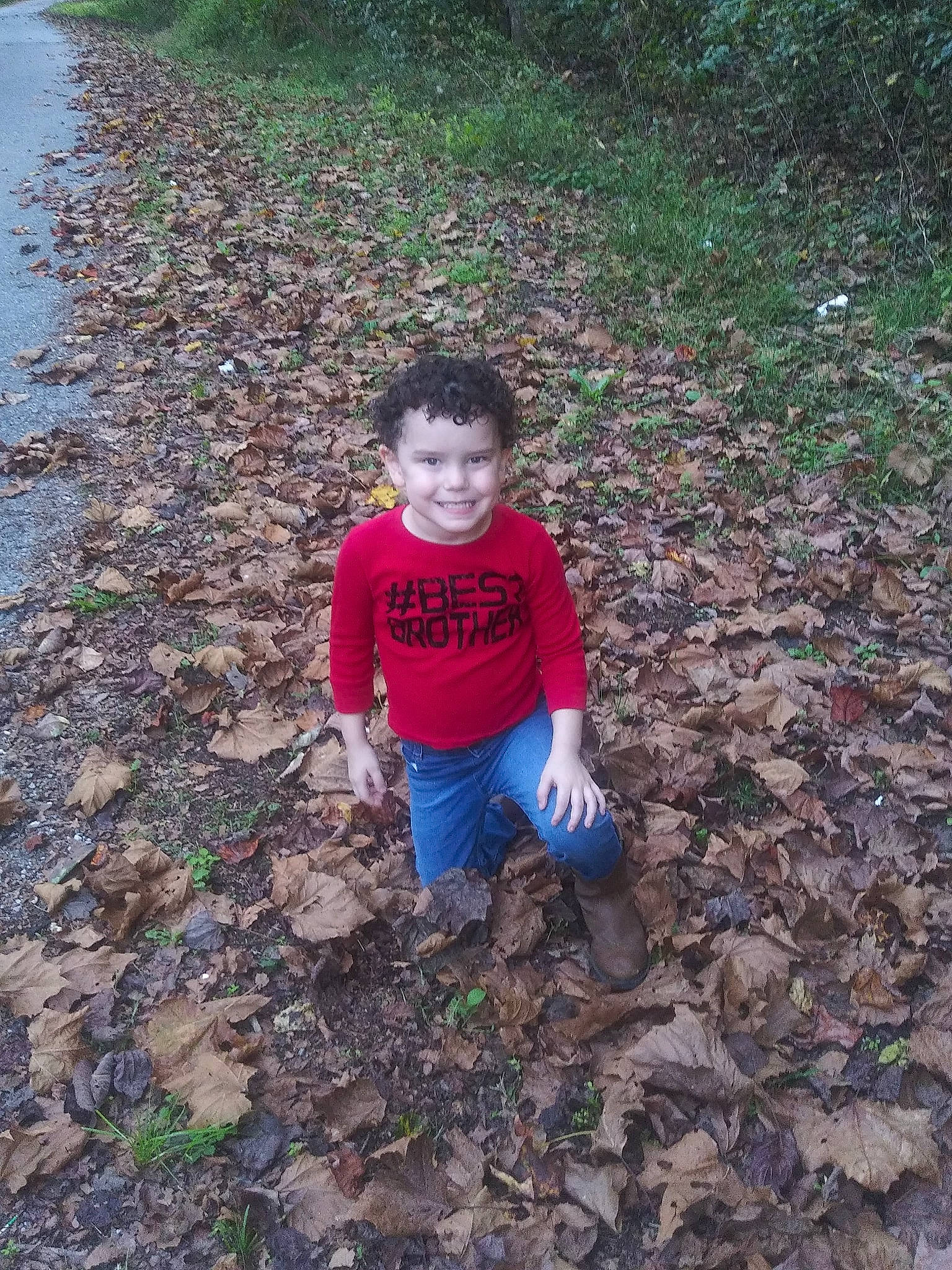 Cale is registered to the contest to win money with this photo: adaptation, asphalt, child, fun, garden, grass, groundcover, joy, landscape, people_in_nature, person, plant, play, sitting, smile, soil, t_shirt, toddler, vertebrate, woodland