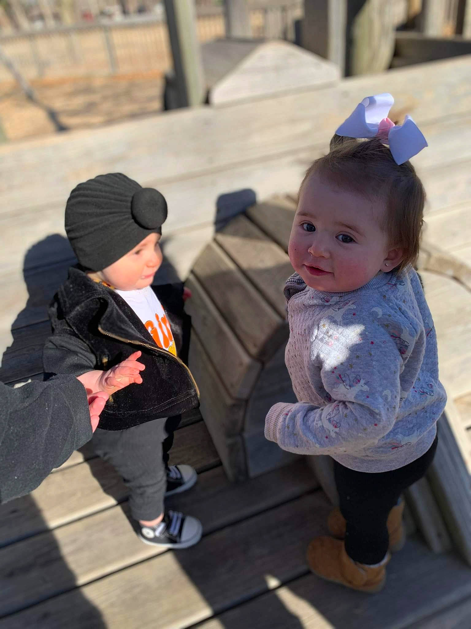 Gabriella is registered to the contest to win money with this photo: baby, child, fun, grass, happy, headgear, human, interaction, leisure, person, public_space, recreation, shoe, sitting, skin, snapshot, sneakers, toddler, travel, tree