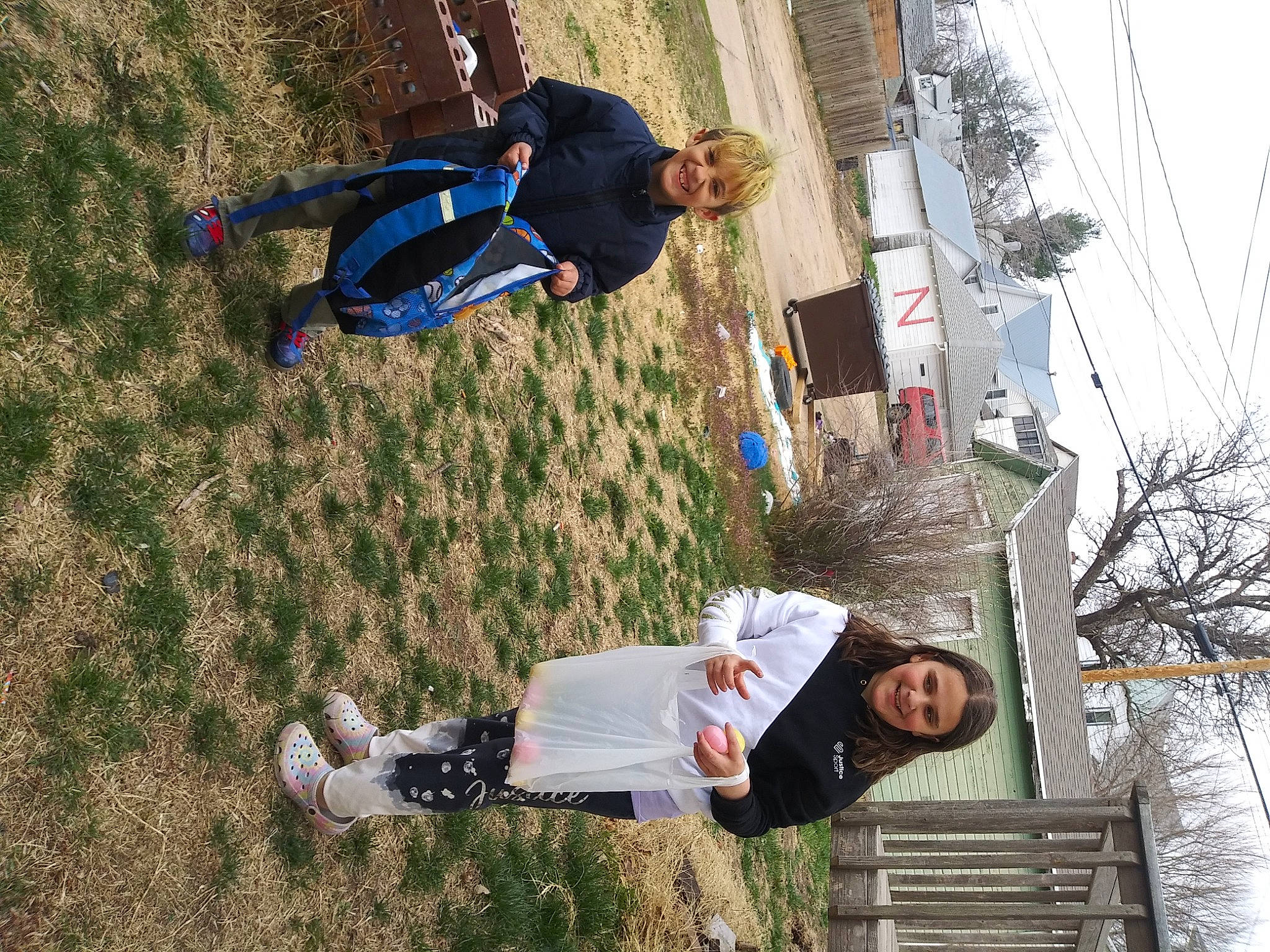 Kiley is registered to the contest to win money with this photo: adventure, bench, child, clothing, fun, grass, jeans, joy, landscape, leisure, people_in_nature, person, plant, play, recreation, sky, slope, sneakers, soil, tree