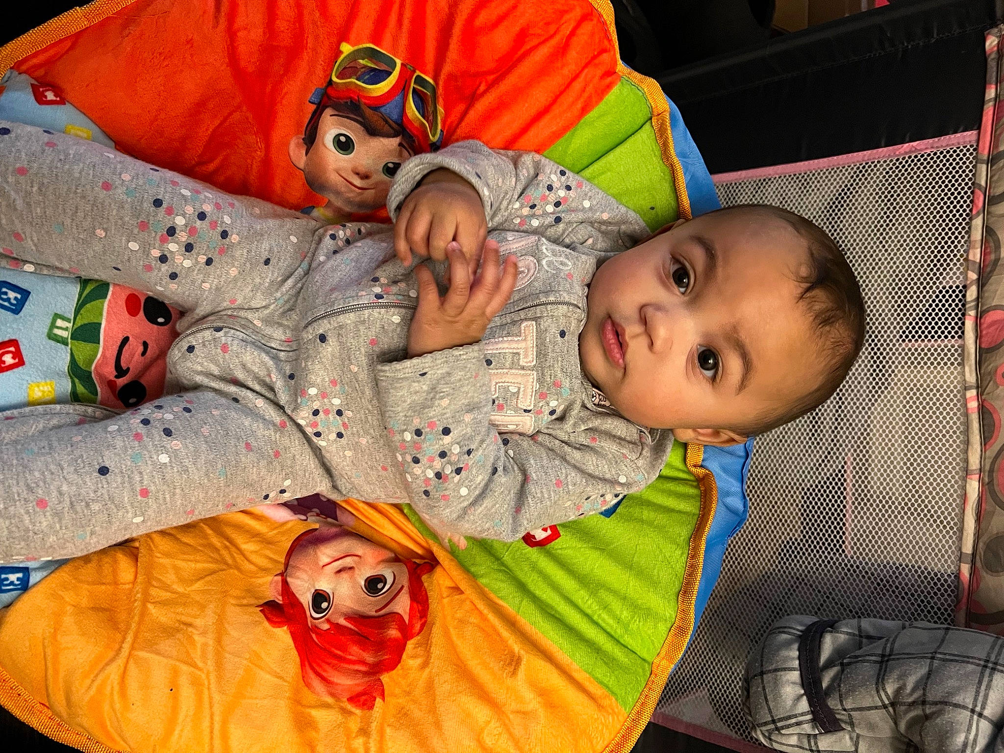 Jessey is registered to the contest to win money with this photo: baby, baby_products, baby_toddler_clothing, baby_toys, cheek, child, comfort, event, fun, happy, linens, mammal, orange, pattern, person, play, room, sitting, textile, toddler