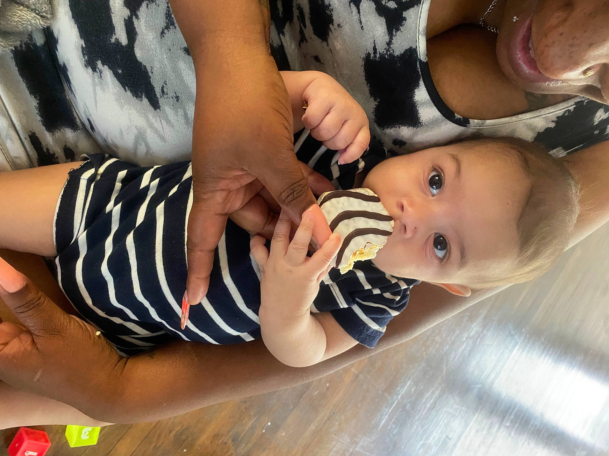 Emilio is registered to the contest to win money with this photo: baby, baby_toddler_clothing, child, comfort_food, elbow, eyelash, finger, fun, gesture, hand, happy, human_leg, nail, pattern, person, table, thigh, thumb, toddler, wrist