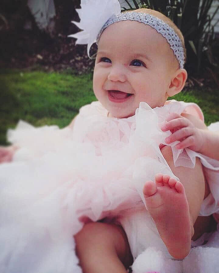 Annalynn joined the competition — help win amazing prizes! baby, cheek, child, dress, face, facial_expression, fashion_accessory, finger, fun, hair_accessory, hand, happy, head, headgear, headpiece, lip, person, pink, skin, smile