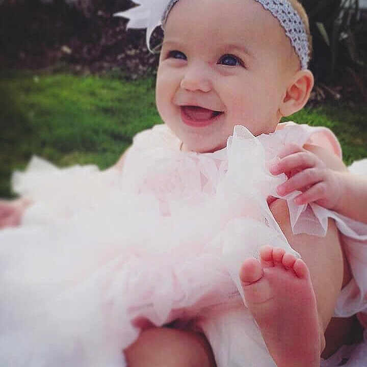 Annalynn joined the competition — help win amazing prizes! baby, cheek, child, dress, face, facial_expression, fashion_accessory, finger, fun, hair_accessory, hand, happy, head, headgear, headpiece, lip, person, pink, skin, smile