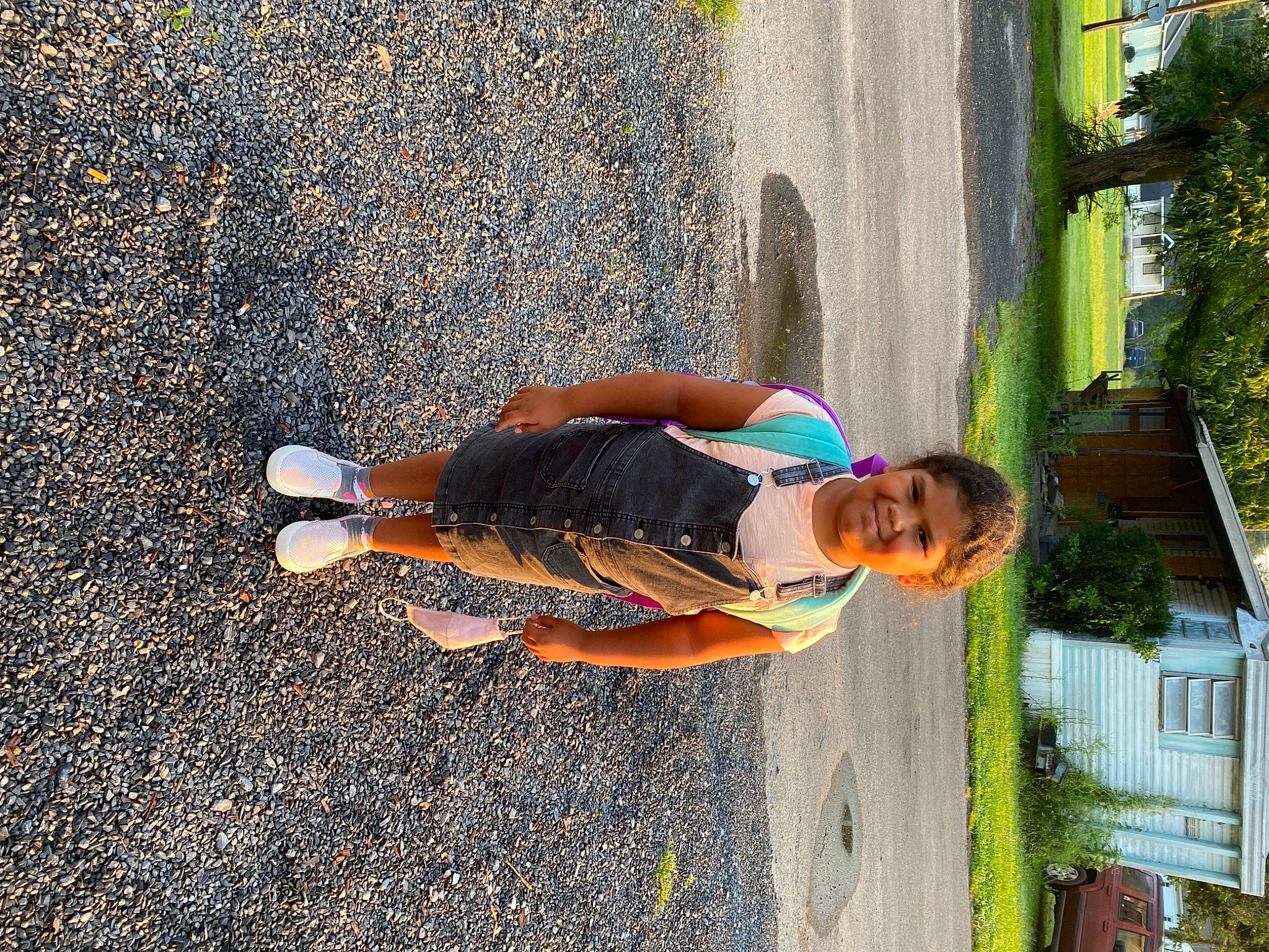 Laila is registered to the contest to win money with this photo: asphalt, child, electric_blue, fun, grass, human_leg, joy, leisure, pedestrian, people_in_nature, person, plant, road, road_surface, shadow, sidewalk, street, thigh, tints_and_shades, toddler