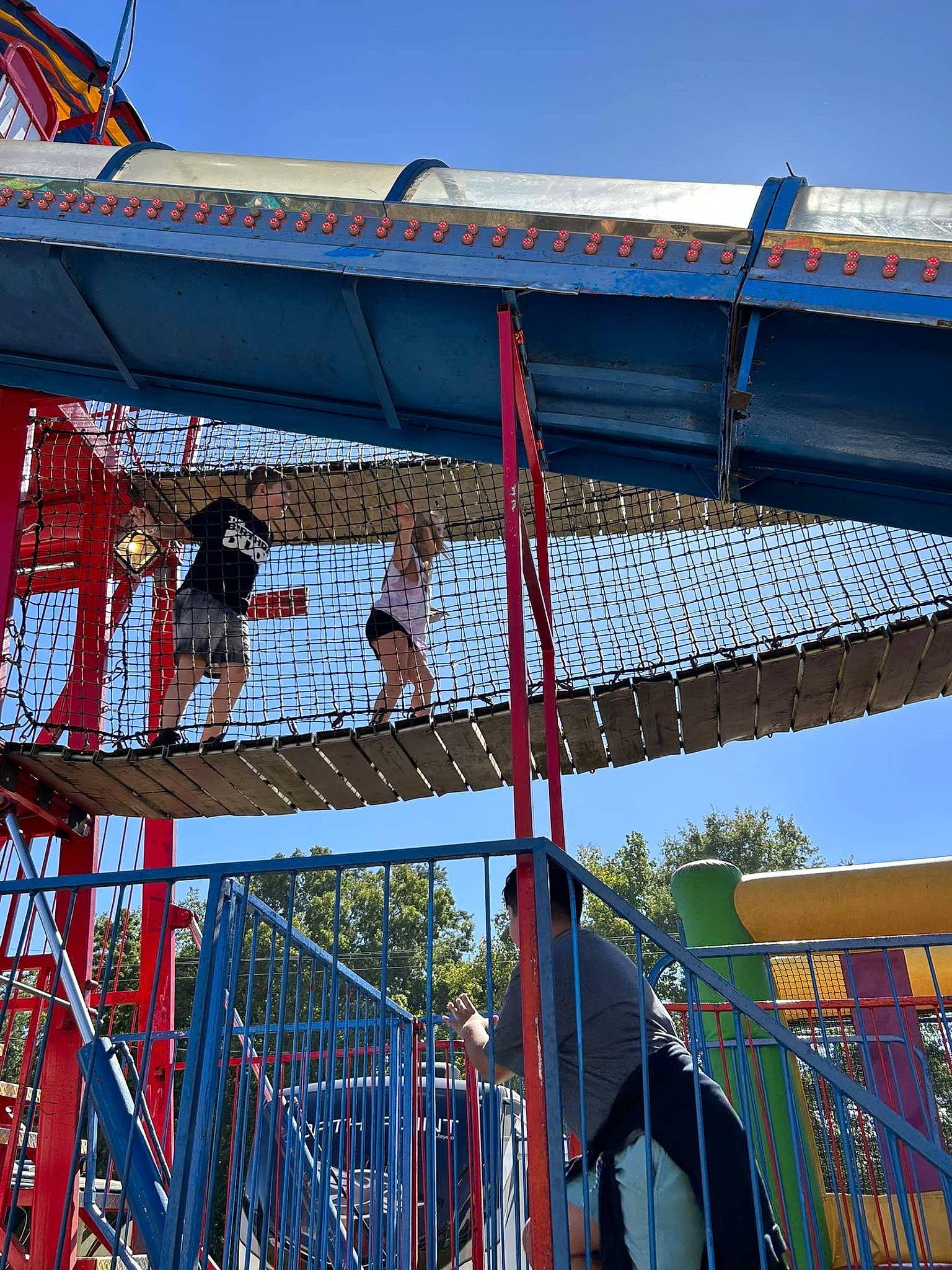 Lilyana joined the competition — help win amazing prizes! amusement_park, amusement_ride, ball, city, event, fair, fun, leisure, nonbuilding_structure, person, pole, public_event, recreation, red, shade, sky, sports, sports_equipment, tourist_attraction, window