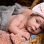 Oaklynn is registered to the contest to win money with this photo: baby, blanket, bodypart, bonnet, cap, clothing, face, finger, hand, happy, hat, head, newborn, person, photography, portrait, smile, sunhat, towel