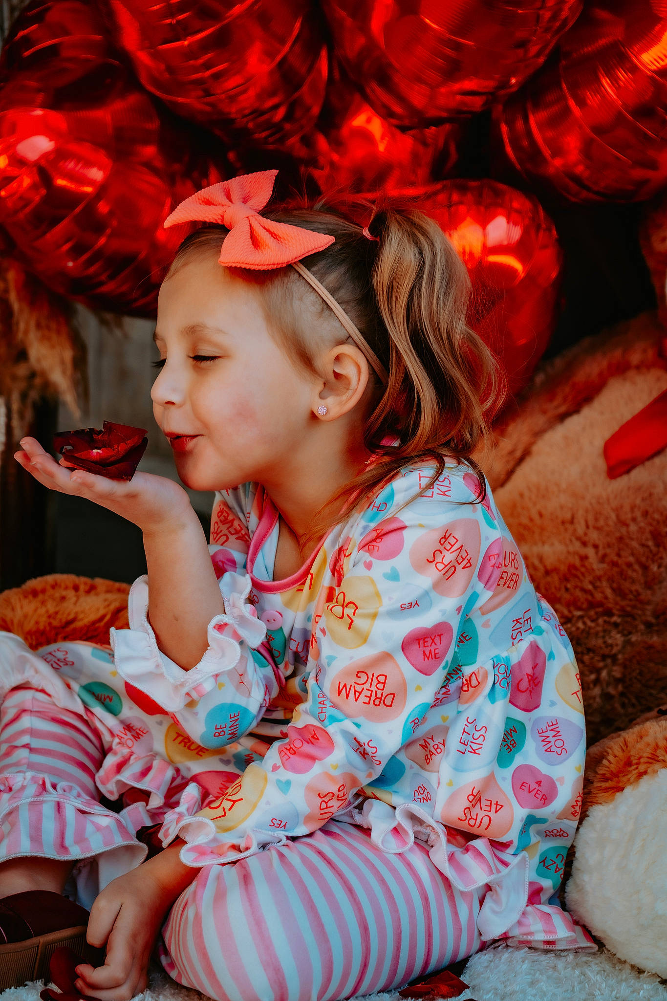 Ava is registered to the contest to win money with this photo: baby_toddler_clothing, child, event, eye, fashion_accessory, fun, happy, headpiece, holiday, human, magenta, pattern, person, pink, red, sitting, skin, smile, textile, toddler