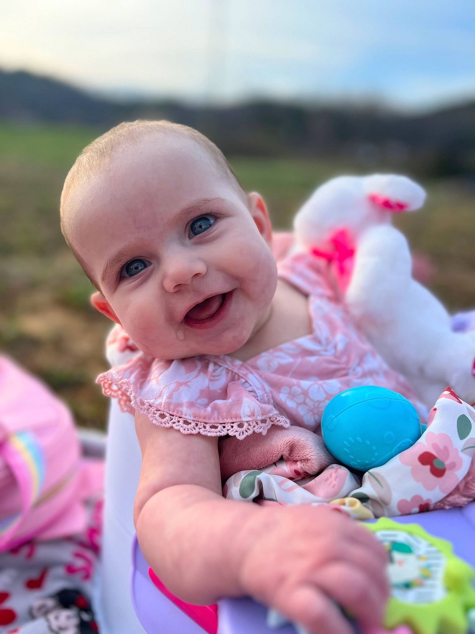 Elouise joined the competition — help win amazing prizes! baby, baby_toddler_clothing, child, event, face, facial_expression, fun, grass, happy, joy, leisure, people, person, pink, recreation, sitting, skin, sky, smile, t_shirt
