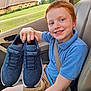 child, boy, red_hair, freckles, blue_polo_shirt, tan_shorts, car_seat, seatbelt, shoes, skechers, smiling, happy, hand, car_interior, window, green_lawn, house, wristbands, casual_clothing, portrait