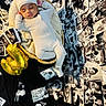 Karson is registered to the contest to win money with this photo: baby, sleeping, basket, knitted_blanket, hat, white_outfit, photographs, black_and_white, collage, balloons, golden_balloons, number_3, celebration, cozy, peaceful, portrait, infant, resting, soft_lighting, background