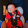 baby, car_seat, pacifier, red_clothing, mickey_mouse, infant, child, seatbelt, straps, foot, hand, face, cute, indoors, young_child, sitting, safety, car, child_safety_seat, closeup
