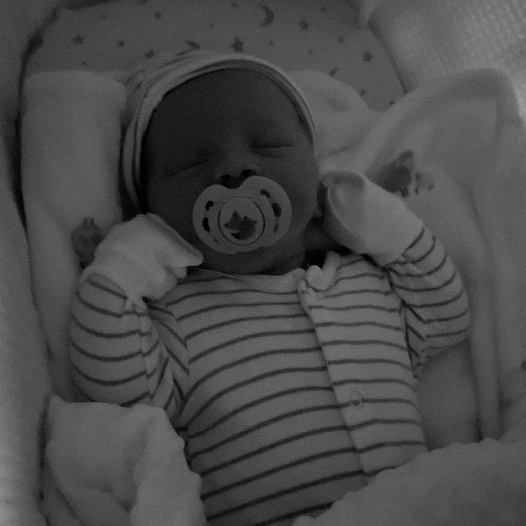 Teddy-James is registered to the contest to win money with this photo: baby, bassinet, bed, blanket, cap, child, cozy, cute, indoors, infant, mittens, newborn, onesie, pacifier, peaceful, portrait, rest, sleeping, soft, striped_clothing