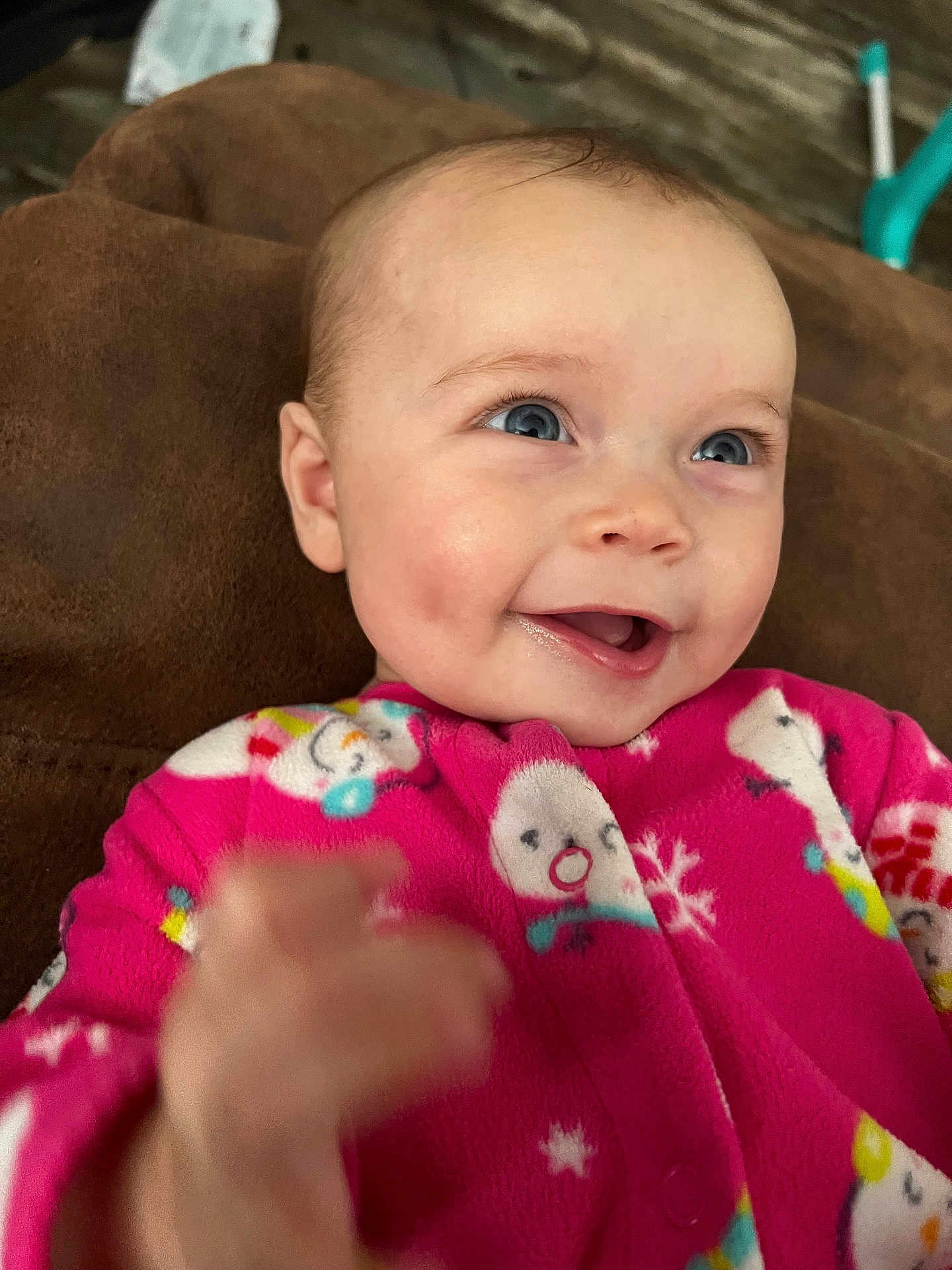 Maizey joined the competition — help win amazing prizes! baby, child, smile, blue_eyes, pink_onesie, snowman_pattern, hand, face, happy, infant, cozy, cute, portrait, indoors, soft_background, candid, expression, skin, person, warm