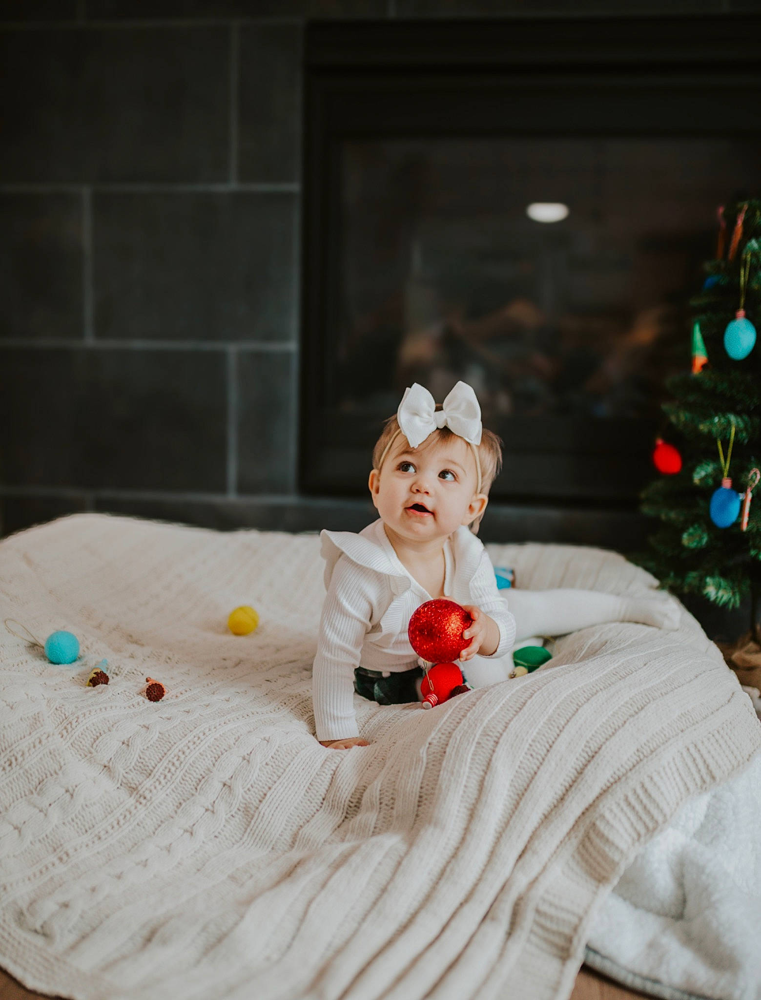 Makenna joined the competition — help win amazing prizes! bed, bed_sheet, bedding, child, christmas_tree, comfort, event, flooring, fun, fur, grass, holiday, leisure, linens, person, plant, room, sitting, textile, toy