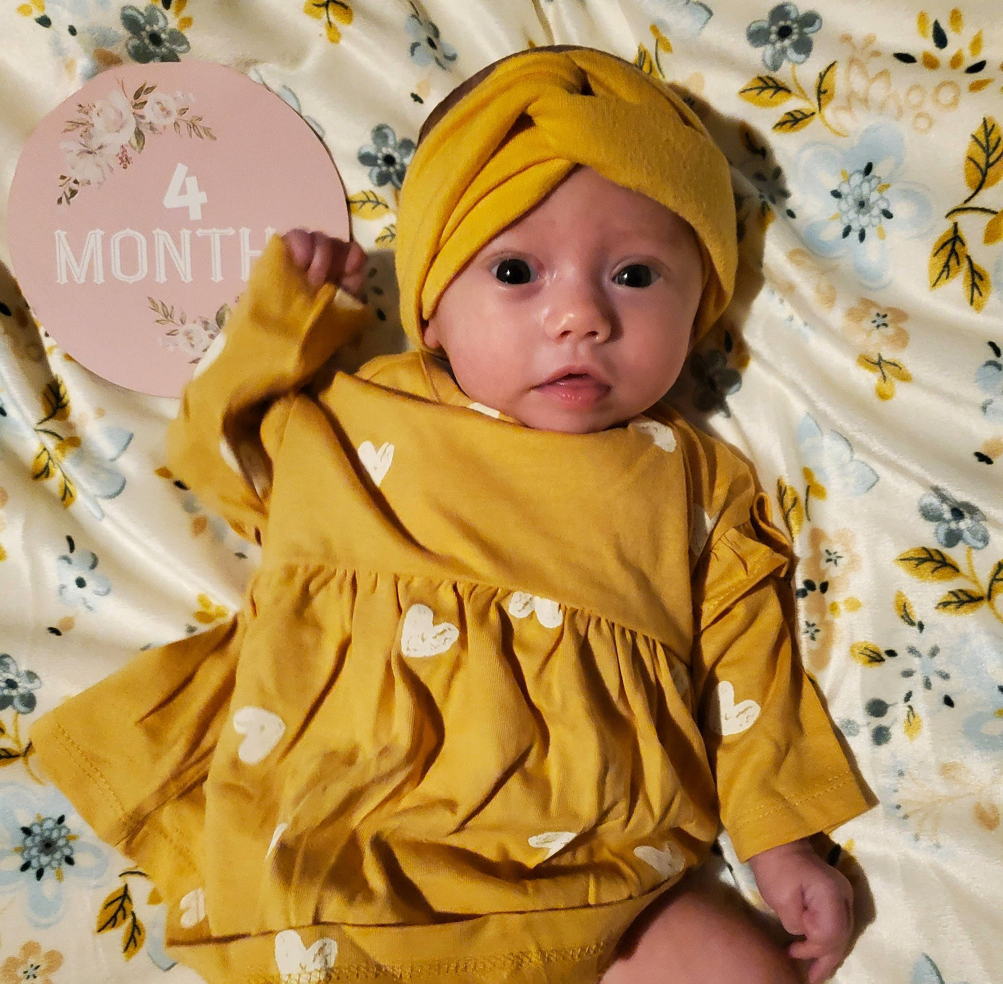 Lydia joined the competition — help win amazing prizes! baby, baby_products, baby_safety, baby_sleeping, baby_toddler_clothing, beanie, cap, child, comfort, happy, headwear, knit_cap, linens, pattern, peach, people_in_nature, person, room, sleeve, textile