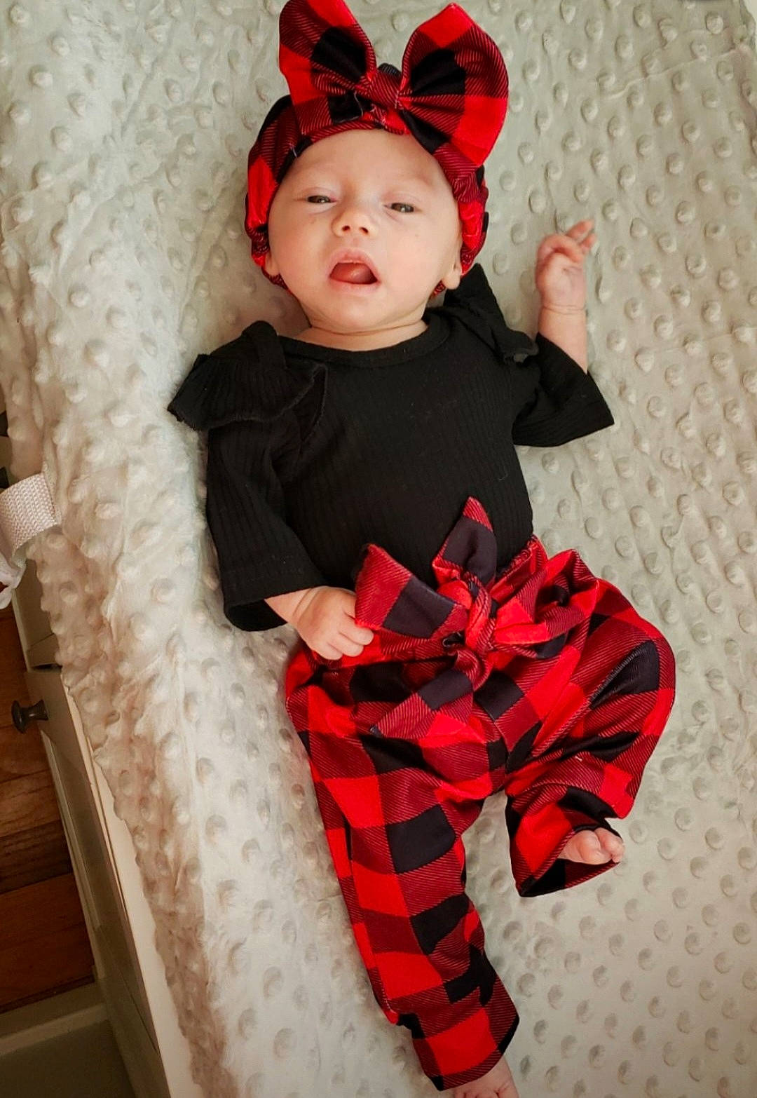 Lydia joined the competition — help win amazing prizes! baby, baby_toddler_clothing, carmine, costume, costume_hat, event, face, fashion, fictional_character, hand, head, headgear, headwear, human_body, outerwear, pattern, person, pink, plaid, sleeve