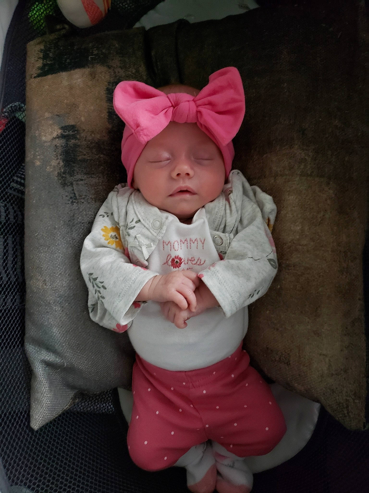 Lydia is registered to the contest to win money with this photo: baby, baby_products, baby_toddler_clothing, beanie, cheek, child, comfort, costume, costume_hat, fun, happy, head, headwear, hood, linens, magenta, person, pink, sitting, skin