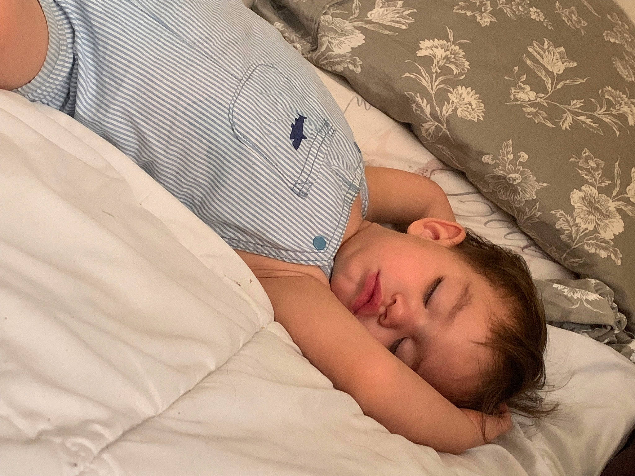 Lucian is registered to the contest to win money with this photo: abdomen, baby, baby_products, baby_sleeping, baby_toddler_clothing, bedding, bedtime, child, comfort, elbow, event, hat, human_leg, linens, nap, pattern, person, skin, sleep, sleeve