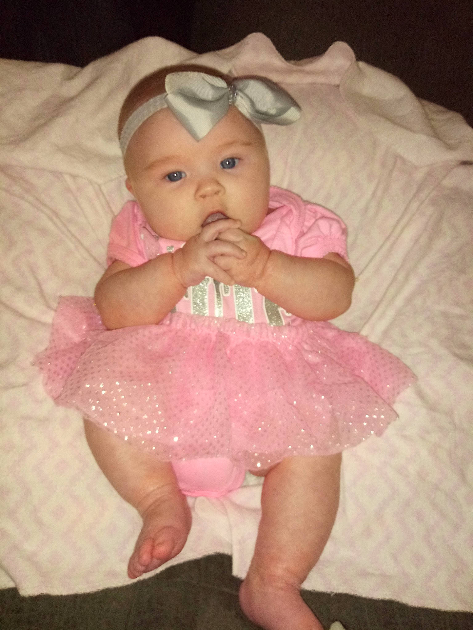 Ensley is registered to the contest to win money with this photo: baby, baby_products, baby_toddler_clothing, cheek, child, eye, face, forehead, fun, hair_accessory, head, headgear, iris, lip, mouth, nose, person, pink, product, skin