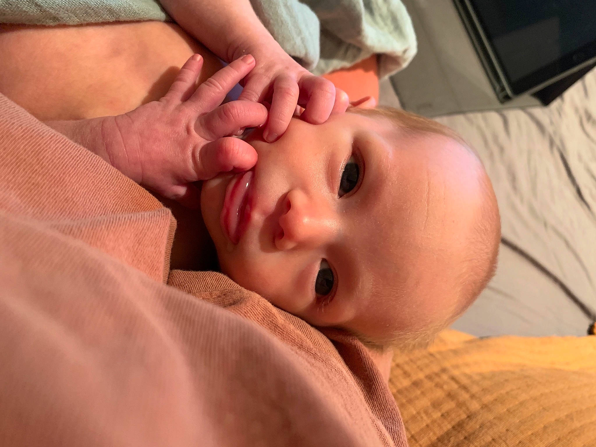 Luna is registered to the contest to win money with this photo: baby, baby_toddler_clothing, cheek, child, close_up, comfort, ear, eyelash, face, finger, gesture, happy, hat, iris, lip, mouth, nose, person, skin, sleeve