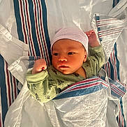 Keegan joined the competition — help win amazing prizes! baby, newborn, infant, blanket, hospital, hat, clothing, lying_down, striped, green_onesie, cute, face, skin, sleepwear, bed, comfort, child, portrait, newborn_hat, swaddled