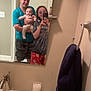 Nova joined the competition — help win amazing prizes! baby, bathroom, clothing, cotton_swabs, door, family, glasses, holding, home, man, mirror, pajamas, person, reflection, sink, smile, tap, towel, wall, woman