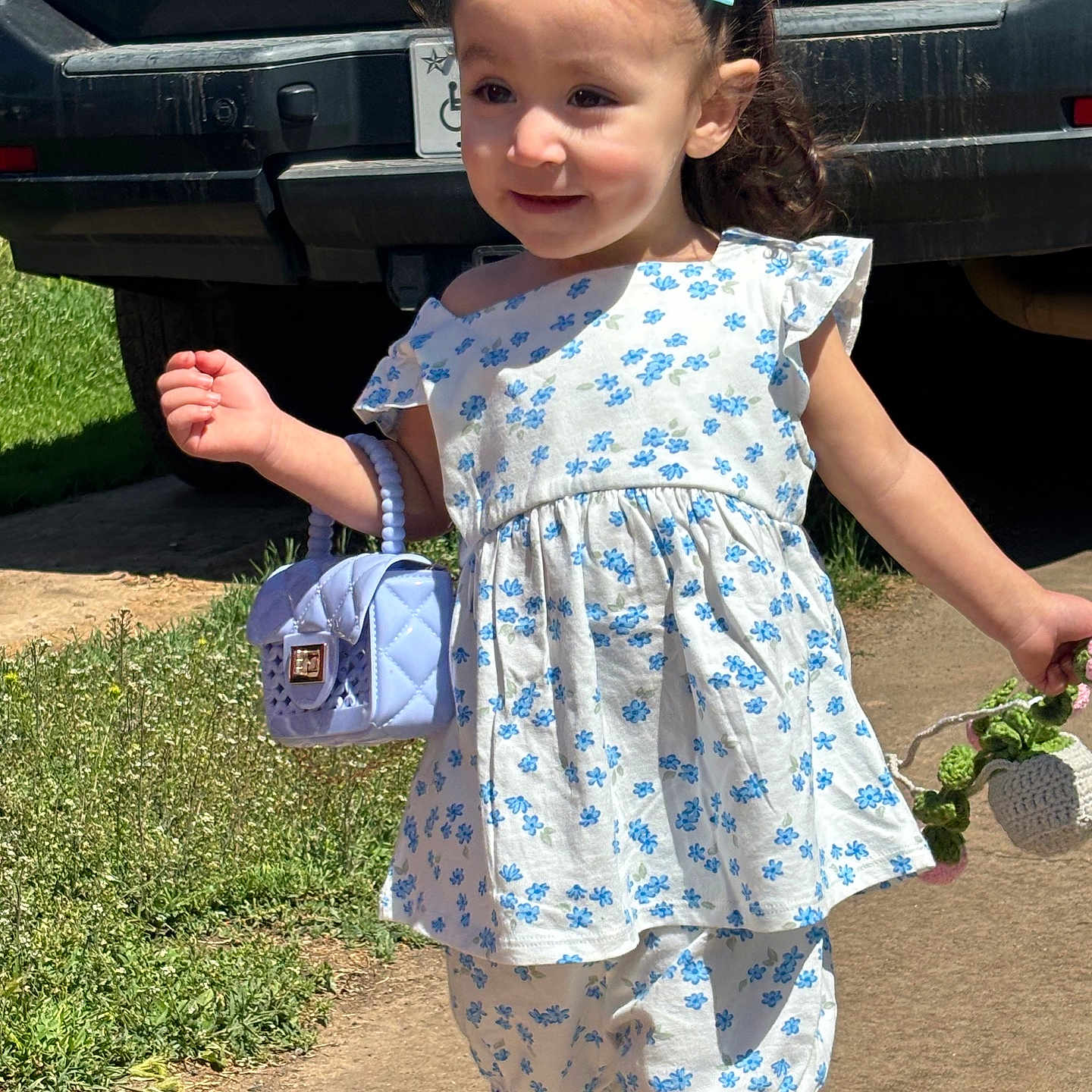 Enya joined the competition — help win amazing prizes! accessories, child, city, clothing, dress, face, female, footwear, girl, grass, head, person, photography, plant, portrait, road, sandal, shorts, street, urban