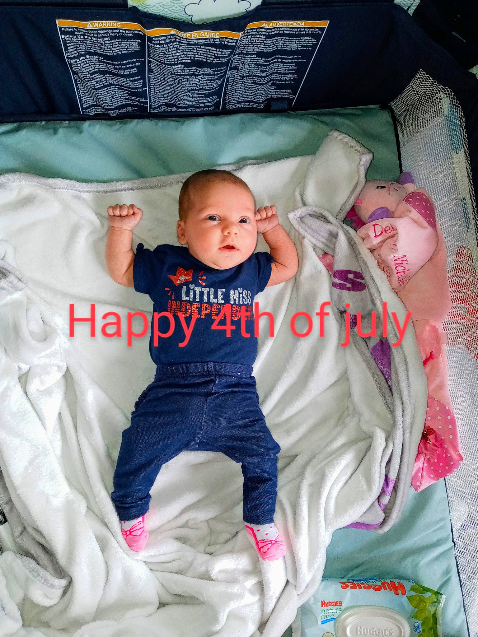 Delaney is registered to the contest to win money with this photo: baby, baby_products, baby_toddler_clothing, child, comfort, font, fun, happy, head, linens, person, pillow, pink, product, room, sitting, sleeve, t_shirt, textile, toddler
