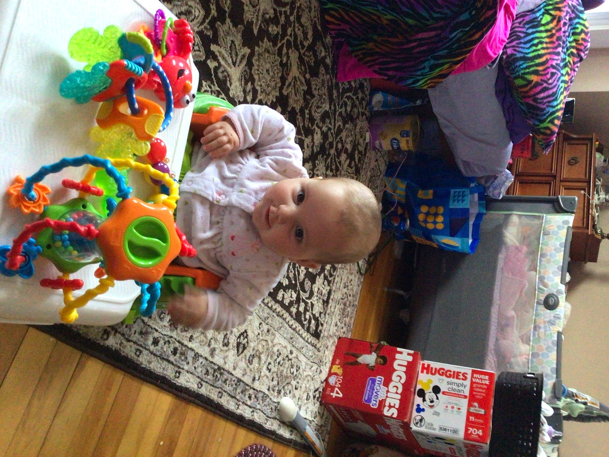 Delaney Sanborn is registered to the contest to win money with this photo: baby, baby_products, baby_toys, child, event, flooring, fun, happy, hat, leisure, party_supply, person, play, room, toddler, toy, wood