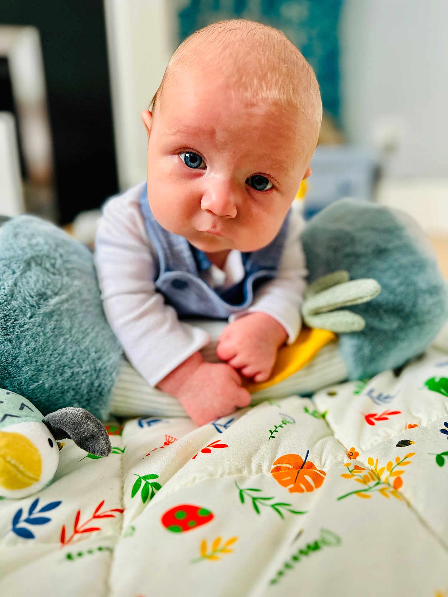 Cobe joined the competition — help win amazing prizes! baby, infant, blue_eyes, plush_toy, blanket, colorful, pattern, cute, portrait, indoors, child, young, clothing, soft, hand, lying_down, expression, face, looking_at_camera, closeup
