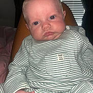 Vinnie joined the competition — help win amazing prizes! baby, infant, face, person, striped_clothing, onesie, hand, legs, indoor, window_blinds, curtains, red_eye, skin, expression, child, portrait, sitting, closeup, flash_photography, home